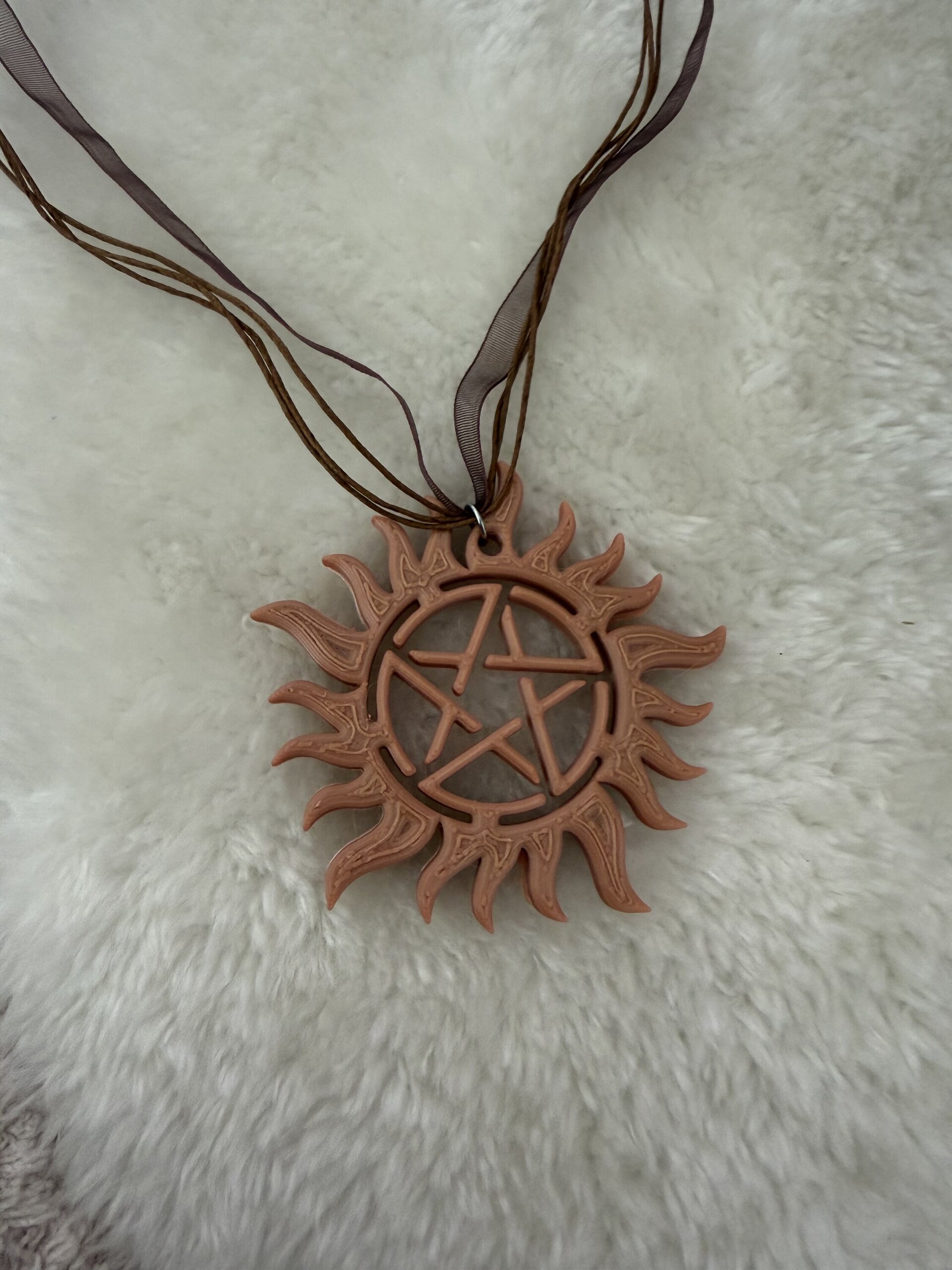 Colgante simbolo Antiposesion SPN - 4